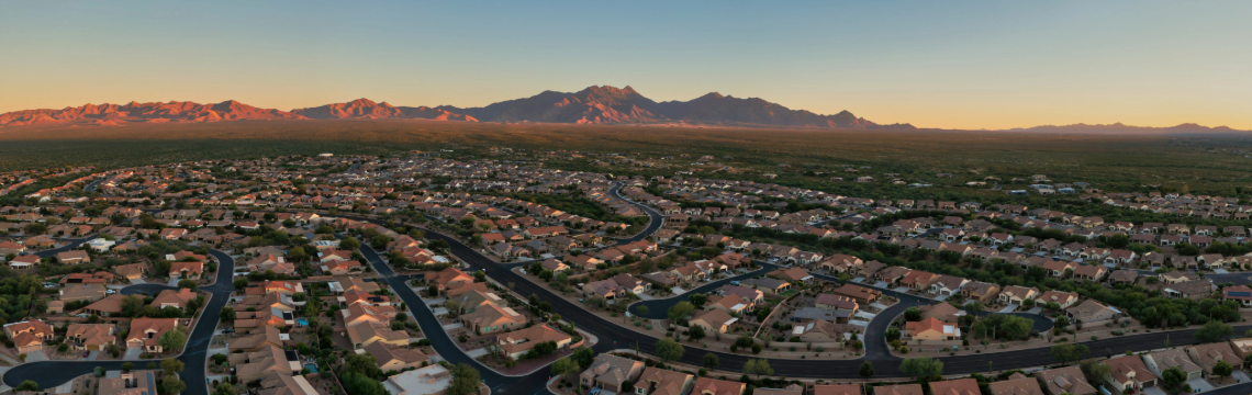 Neighborhood homes in Arizona with mountains in the background.