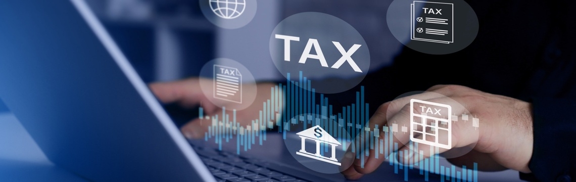 Person behind a computer managing tax compliance