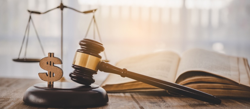 Gavel with a dollar sign, justice scales, and open book.