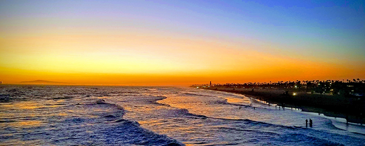 Huntington Beach, California, waves on beach at sunset