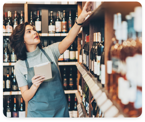 Woman Purchasing a Bottle of Wine