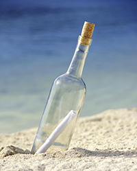 Message in a bottle on an isolated beach