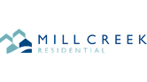 Logo Mill Creek Residential représentant des formes de montagnes bleues stylisées.