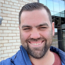 Professional headshot of Benjamin Clementz, smiling outdoors. Suitable for speaker bios, landing pages, and team profiles.