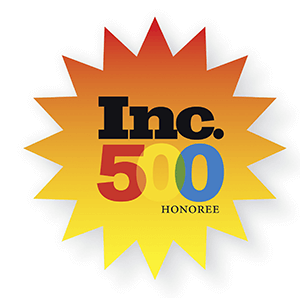 "Inc. 500 Honoree badge with a gradient orange and yellow starburst design."