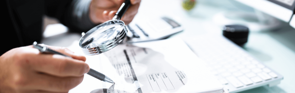 person-examining-paperwork person examining paperwork