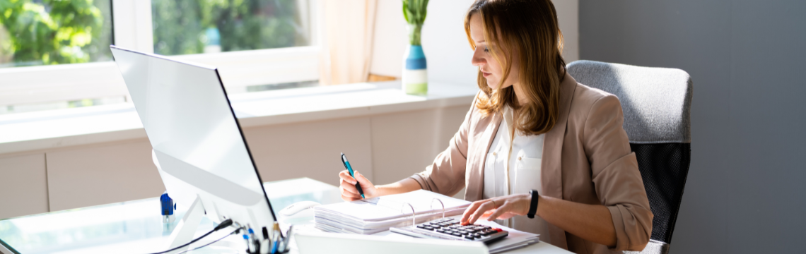 How practices are adapting to the ongoing accountant shortage Accountant at work in their office.