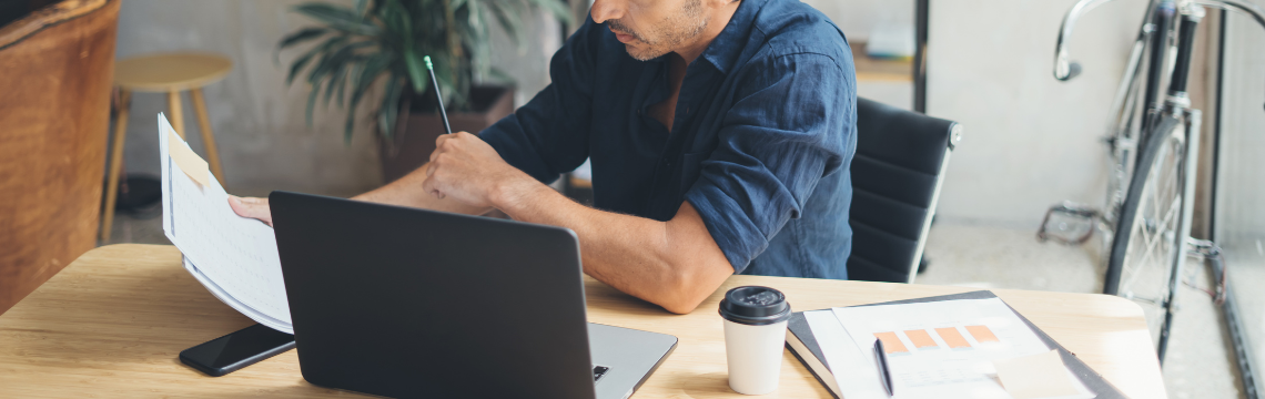Man reading report about states with no sales tax