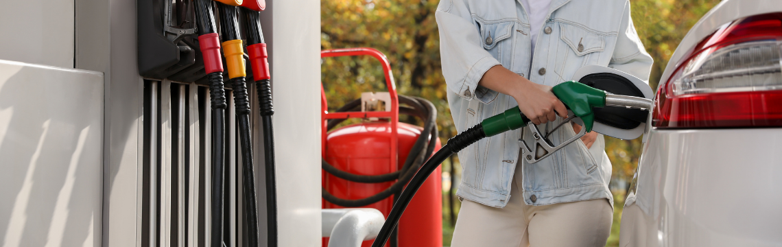 Fueling car at gas station person fueling car at gas station