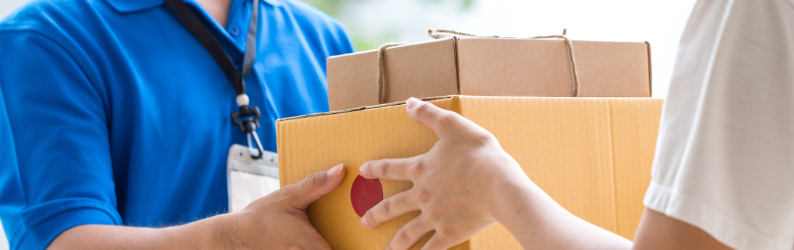 Person delivering a package into the hands of a consumer